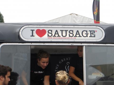 These girls really love sausage.  That guy looks kinda like he does, too.